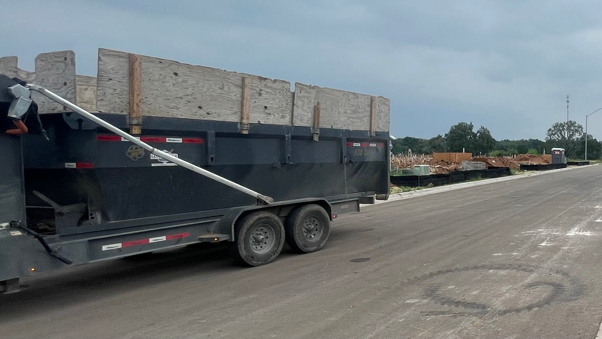 18-yard dumpster rental flat rate  5 tons at a residential construction site in Central Texas